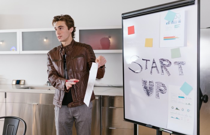 Photo of a person discussing something which could be related to statup idea.